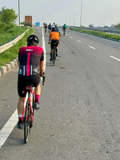 Taking on the open highway during a 100 km century ride. Our endurance cycling challenges are all about building stamina and mental fortitude as a group, covering long distances together.