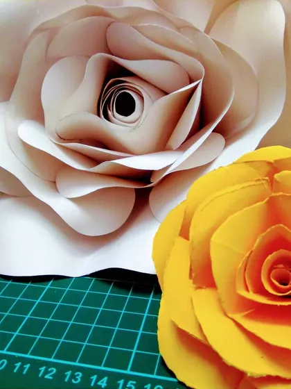 I made these large paper flowers for my nieces' birthday party decorations. They can be customized in any color and are perfect for weddings, birthdays, or baby showers.