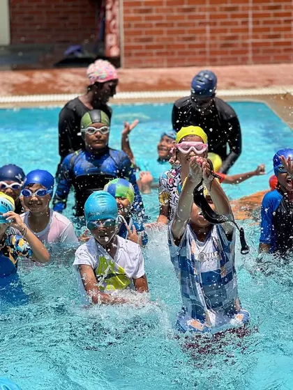A snapshot of the energy and fun from one of our regular swimming classes. You can see our coaches right in the water with the kids, making a splash and learning together.