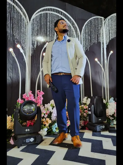 On the stage at a Sangeet, surrounded by lights and flowers. I love creating a magical atmosphere for the couple and their loved ones.