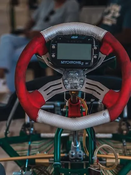 A detailed view of the steering wheel and MyChron data logger. This is the driver's command center, where they receive real time information during a race.