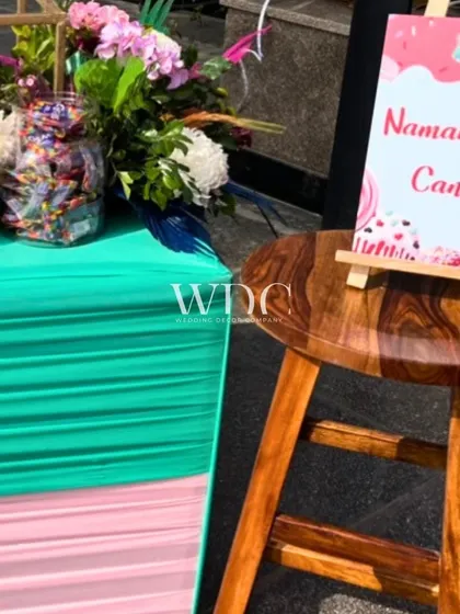 A sweet and personal touch. The candy station, named 'NamansEyeCanDi', offered a variety of treats for guests to enjoy, adding a fun and playful element to the Mehendi.