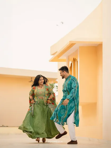 A playful moment between the couple, captured during their vibrant Haldi celebration.