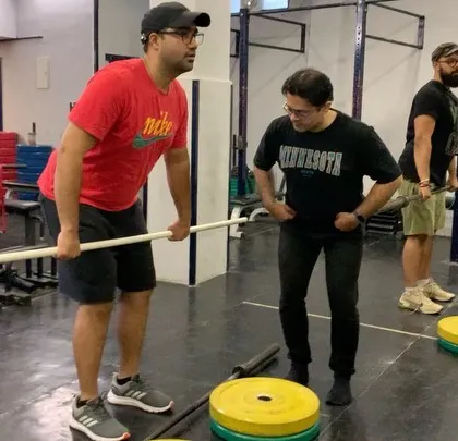 Here I am during one of our weightlifting seminars, teaching the finer points of technique. We are committed to helping our community upgrade their skill set to lift better, heavier, and stronger.