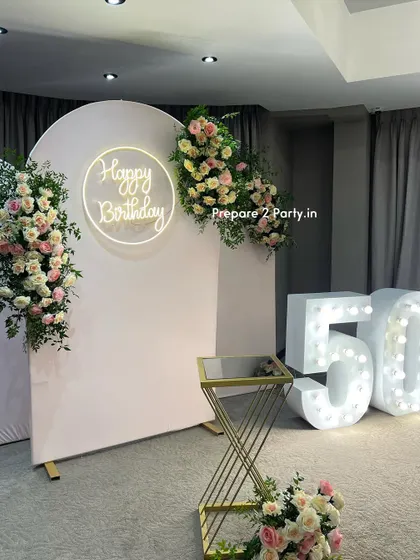 My 50th birthday decorations are designed to be tasteful and celebratory. I offer both floral-heavy designs and modern balloon arrangements to honor this golden milestone.