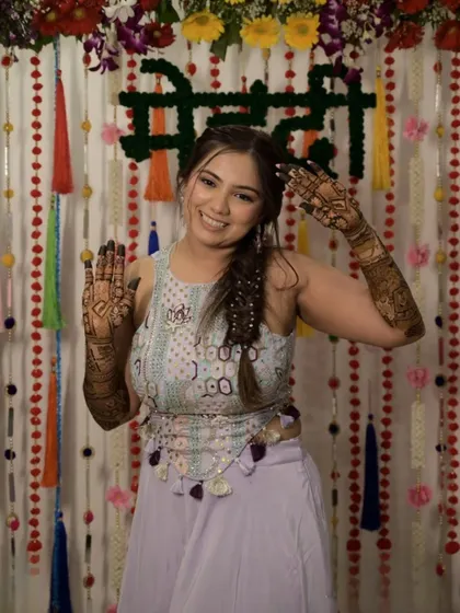 A playful and happy bride at her mehandi ceremony. Her energy is infectious, and her mehandi looks stunning.