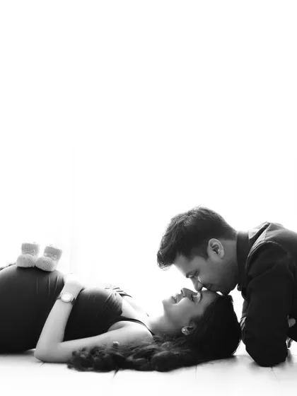 Sometimes, the most powerful moments are the quietest. This black and white maternity portrait focuses purely on the connection and anticipation between the expecting parents, creating a classic and emotional image that will be cherished forever.