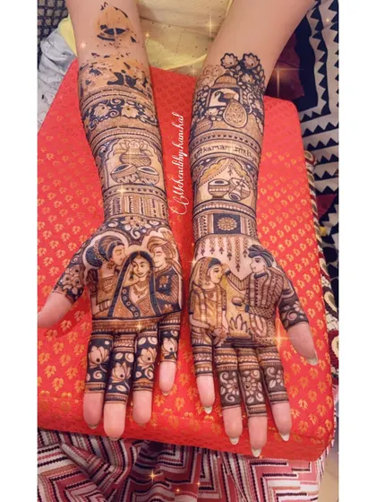 Another shot of the full bridal mehendi, showcasing the intricate details and the beautiful portraits that celebrate the bride's family and her new journey.