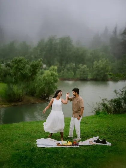 Dancing in the misty landscape. The monsoon provides a magical backdrop for pre-wedding shoots, creating an atmosphere of romance and spontaneity.