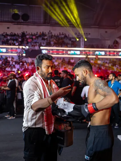 A moment of focus with Mridul before his MFN fight. The mental preparation is just as important as the physical. As his coach, I make sure he is ready for war.
