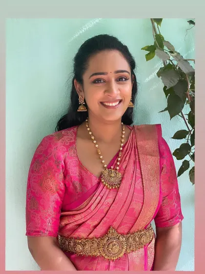A portrait of Smaranita. The makeup is kept natural and radiant, letting her beauty and the gorgeous saree be the main focus.