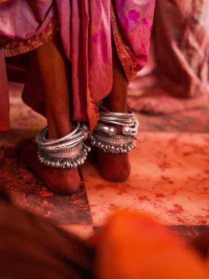 A vibrant collection of images from the Holi celebrations in Braj, specifically Nandgaon. This series captures the pure ecstasy of the festival, with portraits of devotees, men dressed as gopis, and crowds dancing in a cloud of colors.