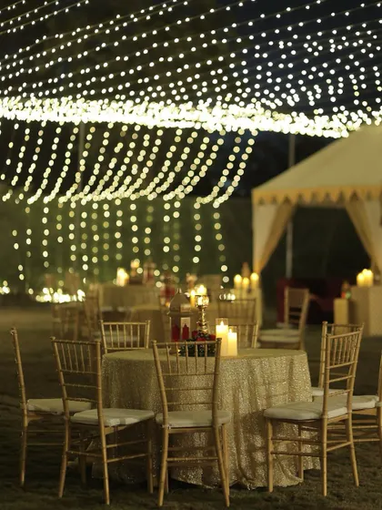 The magical ambiance of the Sufi night, with tables set under a canopy of fairy lights. The combination of intimate candlelight and a sky of lights is pure romance.