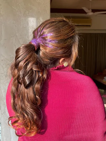 A different angle showing how the glitter is concentrated at the top, creating a cool, modern effect. This is a perfect party hairstyle.