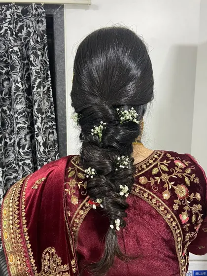 Another view of the beautiful bridal braid, showing how it complements the velvet blouse perfectly.