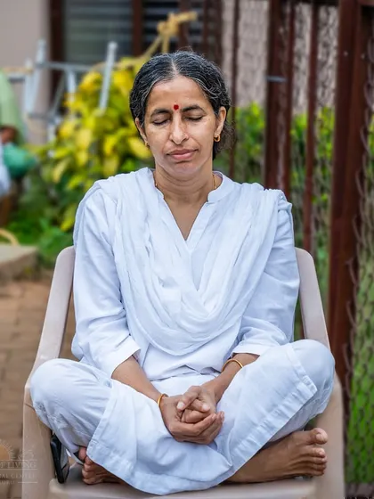 A participant finds stillness and peace during a Monday morning Rudra Puja. Starting the week with meditation and ancient chants helps set a positive and centered tone for the days ahead.