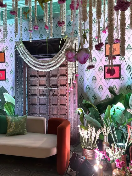 Another angle of the elegant seating area, showing the interplay of modern furniture with traditional Indian decor elements.