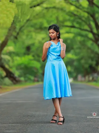 A full-length shot of our sky blue short frock, perfect for a casual pre-wedding shoot or a daytime party.