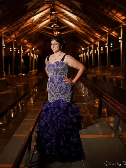 A full-length shot of the purple ruffled gown, designed to make a grand entrance at any celebration.
