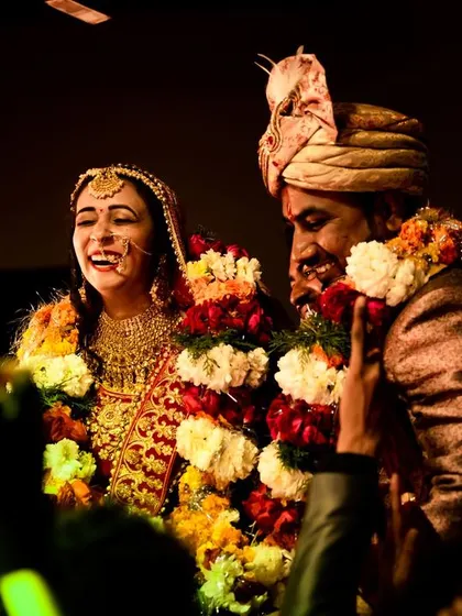 The Varmala is a moment of pure, unscripted joy. I live for capturing these candid smiles and laughter between a couple, the real moments that become the most cherished memories.