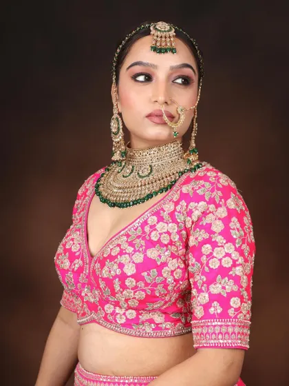 A portrait of the bride. In our course, you will learn how to work with traditional bridal jewelry like the nath and matha patti.