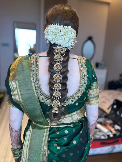 The complete bridal look, showcasing the stunning South Indian braid from top to bottom. This hairstyle is rich in tradition and designed to make a bride feel like royalty.