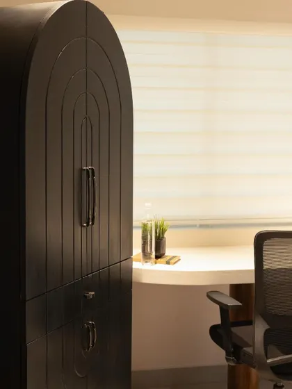 Another angle of the storage cabinet and desk area, showing how the furniture pieces are integrated into the overall office design.