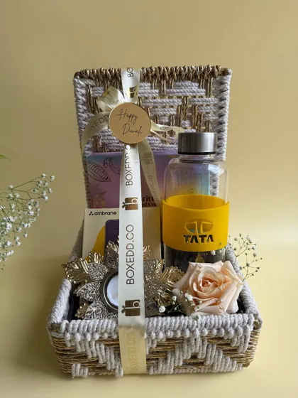 We love bringing a brand's vision to life. This custom Diwali hamper for TATA features a branded water bottle and other curated items, all presented in a beautiful woven basket that reflects both quality and festive warmth.