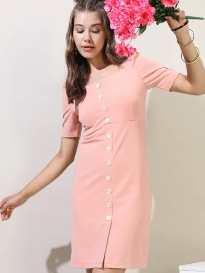A simple yet chic pink button-down dress I styled for a Tokyo Talkies shoot, accessorized with flowers to enhance its feminine appeal.