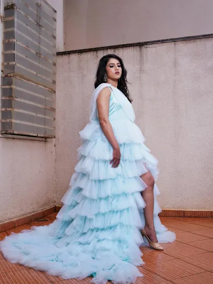 A more dramatic pose from the "Teal Beauty" series. The makeup look, with its subtle teal eyeliner, adds a touch of modern edge to the romantic gown.