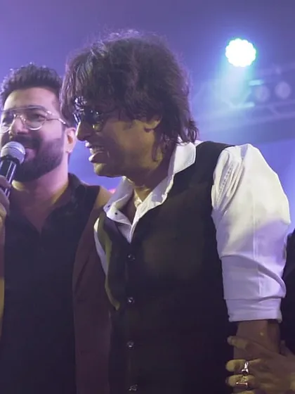 Sharing a moment of camaraderie on stage. The energy exchange between me and the audience is what fuels the show.