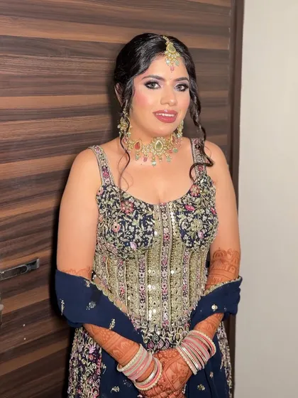 My bride Chandni, looking radiant for her Mata ki Chowki. We created a soft glam look with a focus on her eyes to complement her heavily embellished outfit.