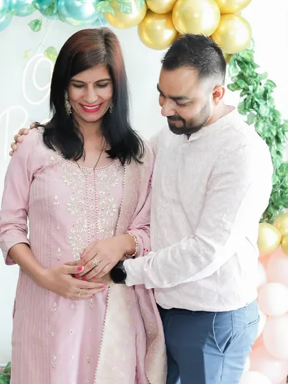 Capturing the shared look between a couple at their baby shower. These quiet, emotional interactions are just as important as the big, celebratory shots.