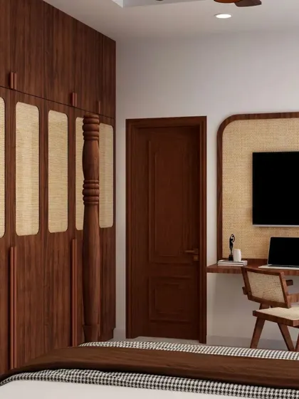 This shot shows the integrated TV and study desk, which features a rattan panel backdrop that matches the wardrobe, creating a cohesive and rustic-chic design.