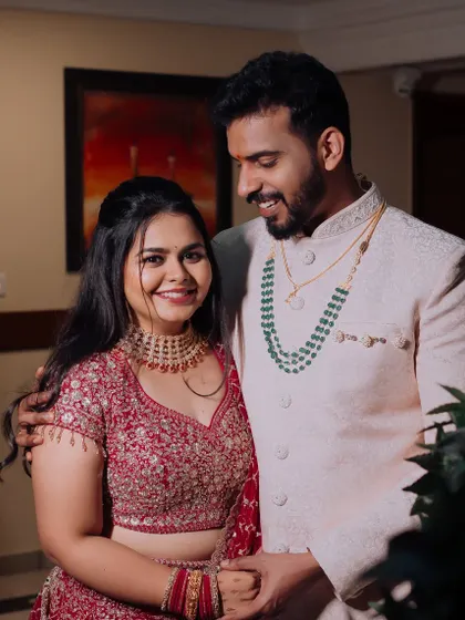 A happy couple shot from Dr. Meghana's ring ceremony. Her makeup is soft and romantic, perfect for these cherished moments.