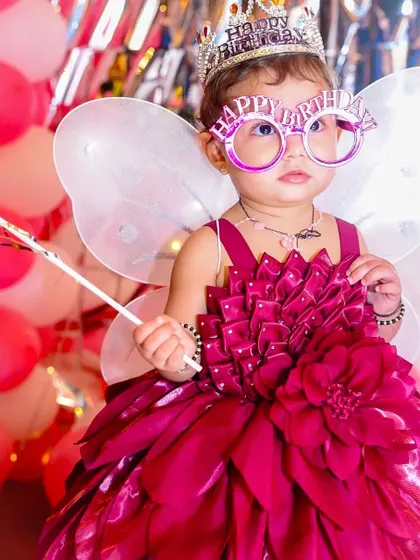 Another adorable shot of the birthday princess, this time with fun "Happy Birthday" glasses, ready to party.