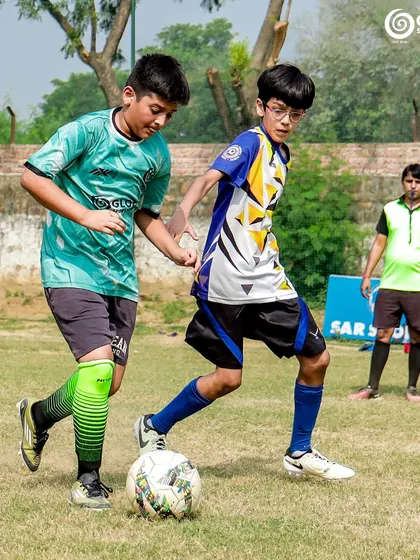 A GSC player shields the ball from an MVTFA opponent.