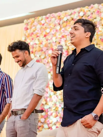 A wedding evening is about speaking from the heart. Here, a friend gives a heartfelt toast, sharing memories and embarrassing stories, which is a cherished part of any celebration.