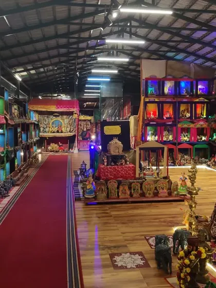 A long shot of the exhibition hall, giving a sense of the scale of our Navaratra Mahotsava. The entire space is transformed into a narrative landscape built with dolls.