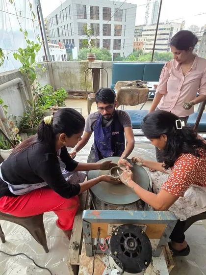 A group session in full swing on the rooftop. You can see me guiding participants at the wheel, with the open sky and city buildings behind us.