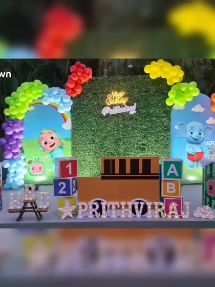 Another angle of the outdoor Cocomelon theme, highlighting the light-up name and character props that complete the look.