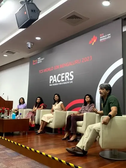 On stage during the TCS World 10K pacers panel. My role here is to facilitate a conversation that provides real value to the runners in the audience. This is part of our commitment to not just organize races, but to educate and empower the running community.