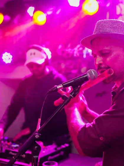 I love creating unique experiences by collaborating with live musicians. Here I am mixing a fusion set with a live flutist, blending electronic beats with soulful melodies for a private party.