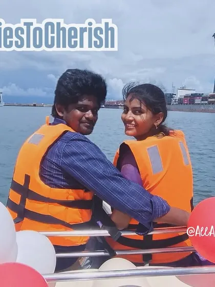 A couple enjoying their luxurious yacht ride with the Chennai port in the background. This experience offers a unique view of the city from the sea.