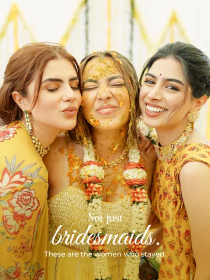 Not just bridesmaids. These are the women who stayed. A bride and her closest friends sharing a moment of pure, uninhibited joy during the haldi.