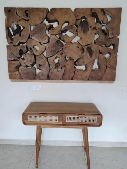 I can also source unique furniture pieces like this wooden console table and abstract wall art to complement your indoor or outdoor design.