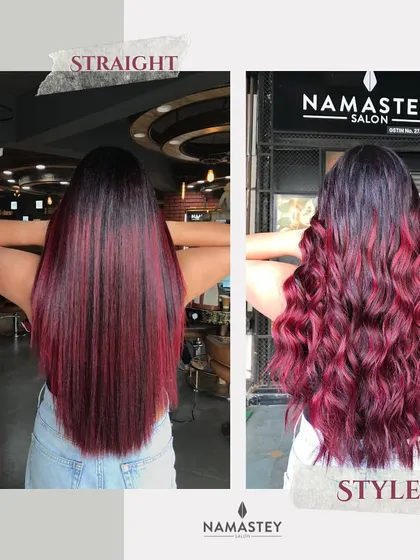 This image shows the versatility of the red wine color, looking equally stunning whether styled straight or in curls.