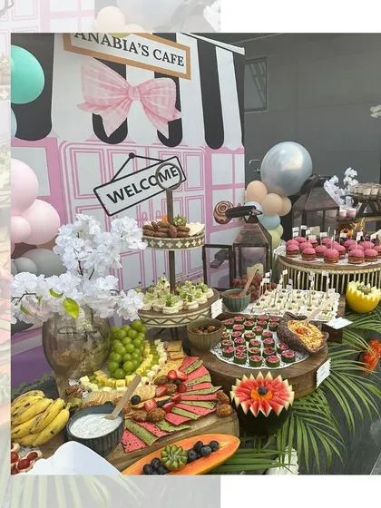 A beautiful grazing table for "Anabia's Cafe" themed party, featuring a wide array of colourful and delicious treats that are as fun to look at as they are to eat.