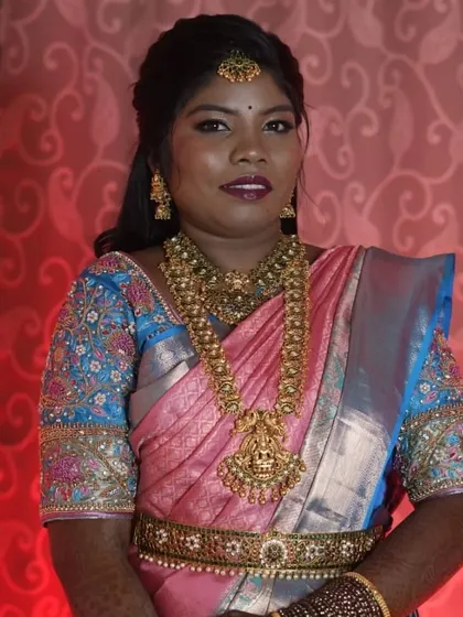 Happy bride Jacintha looking gorgeous in a traditional gold-finish temple jewellery set for her wedding.