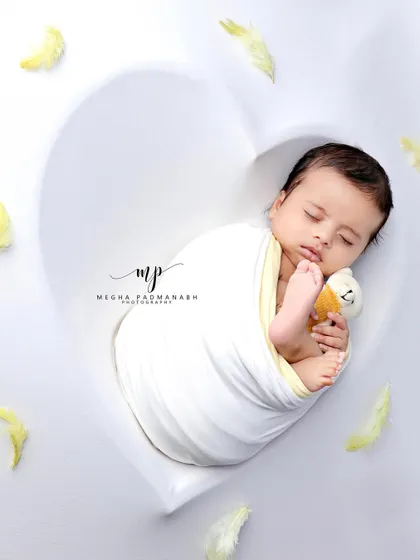 A different angle of this adorable duo, capturing a moment of pure innocence.